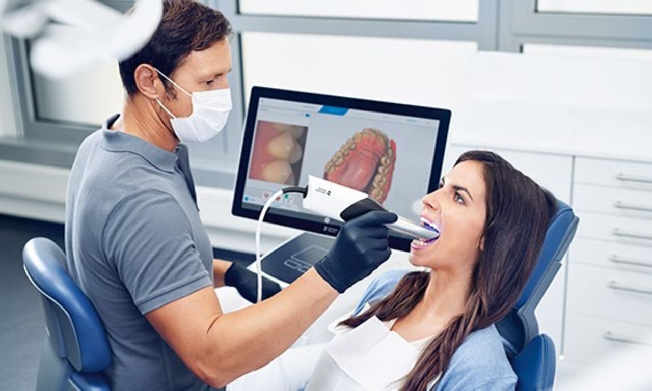 Dentist taking digital impression with Primescan