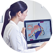 Dentists performing model analysis with CEREC Ortho